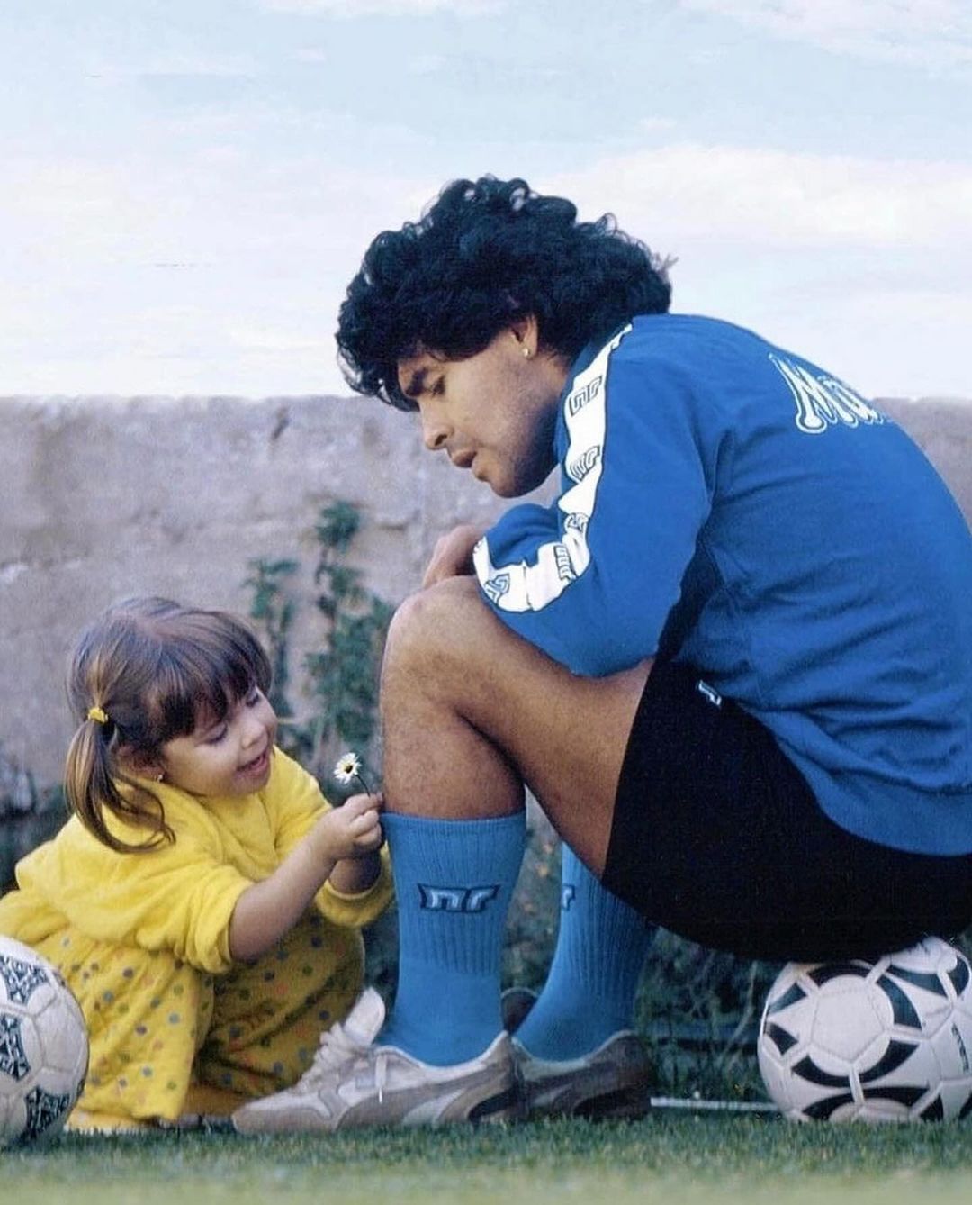 Diego Maradonas daughter picks flowers for her father which he proudly wears during training 1989
